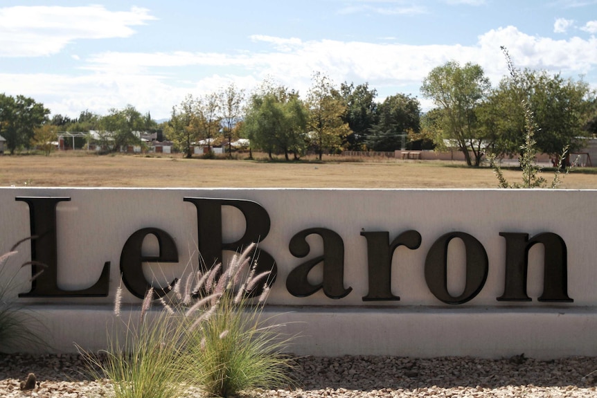 A sign marks the entry to Colonia LeBaron