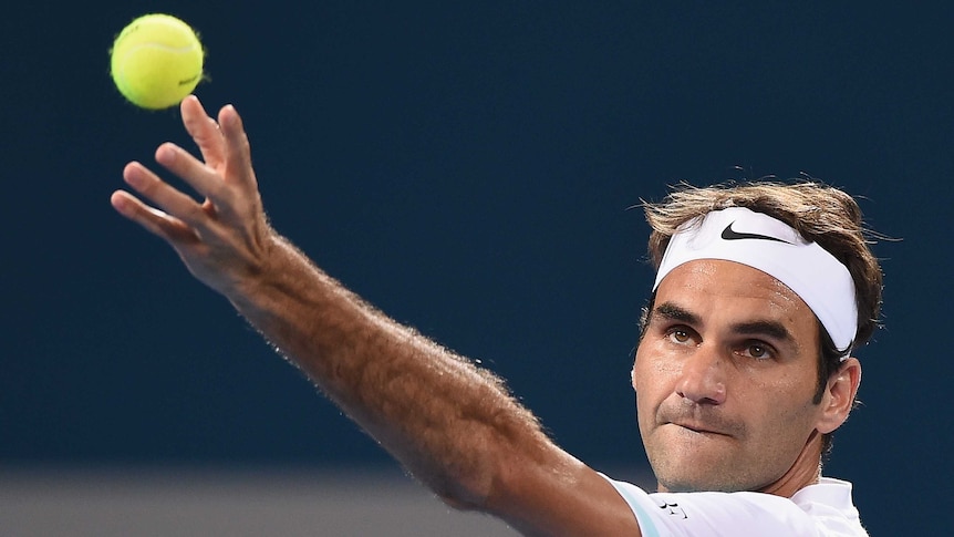 Federer prepares to serve at the Brisbane International
