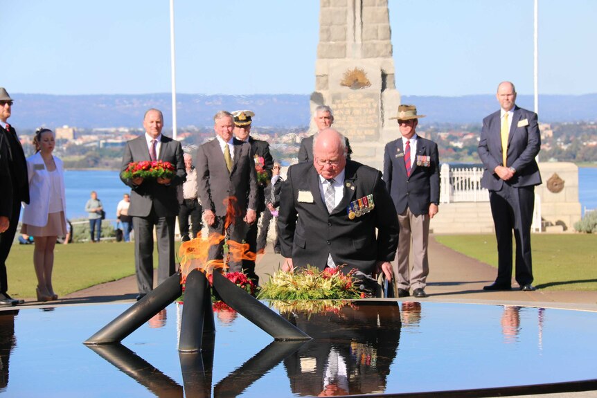 RSL president Graham Edwards places a wreath at Kings Park memorial