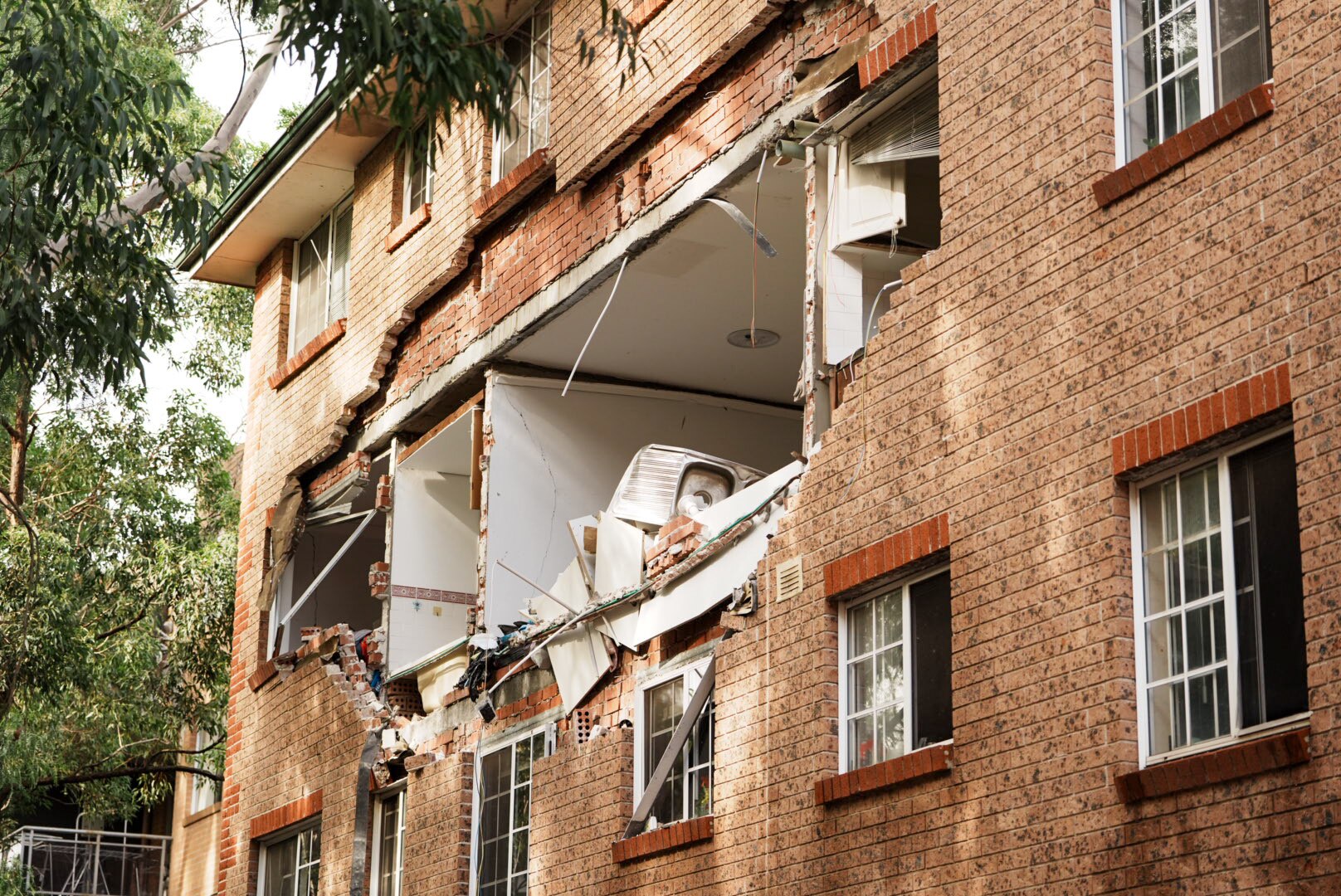 A hole in a brick apartment block.