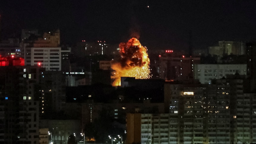 An explosion of a drone in the night sky.