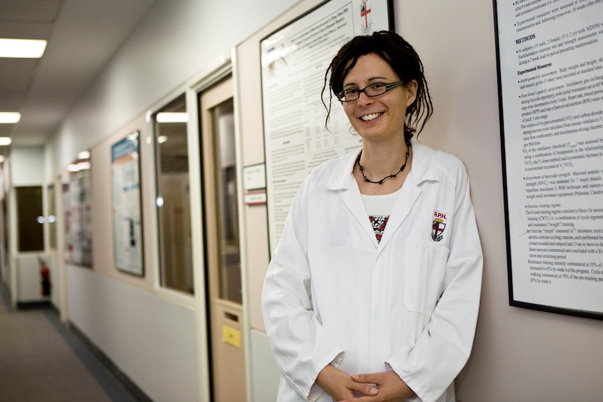 Dr Zoe Hyden in a white lab coat