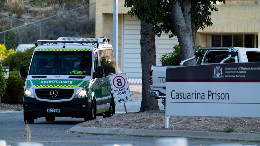 An ambulance parked next to the Casuarina Prison sign