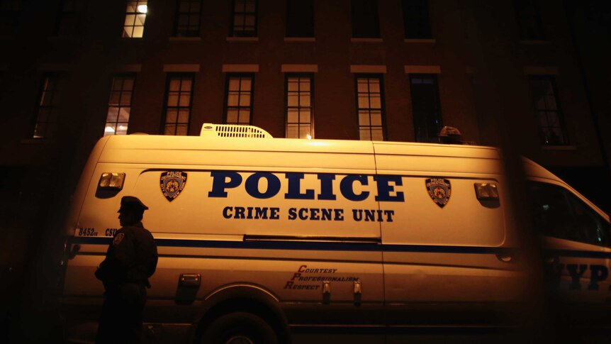 A police van outside Hoffman's apartment