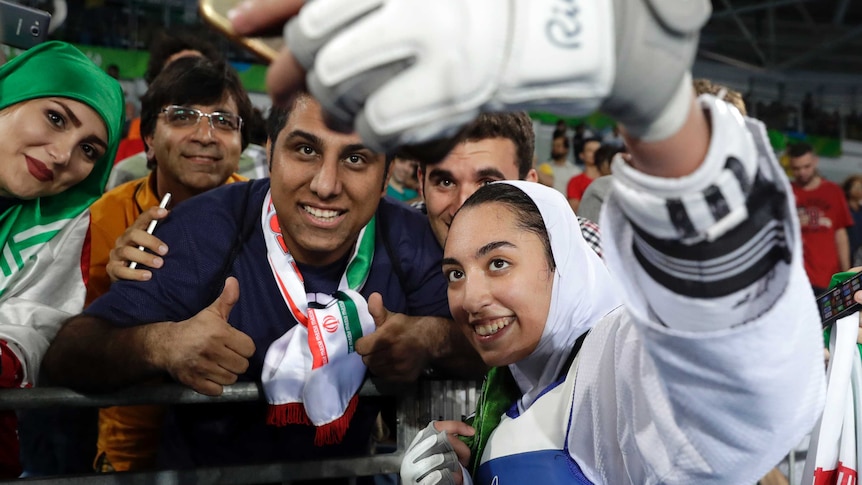 Kimia Alizadeh celebrates with Iran fans after winning Rio bronze
