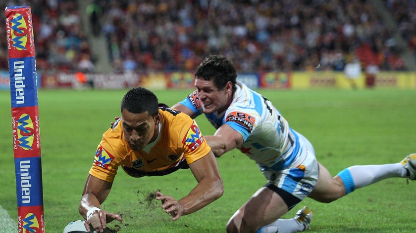 Focused on footy: Israel Folau left uncertainty about his future in the sheds and scored two tries for Brisbane.