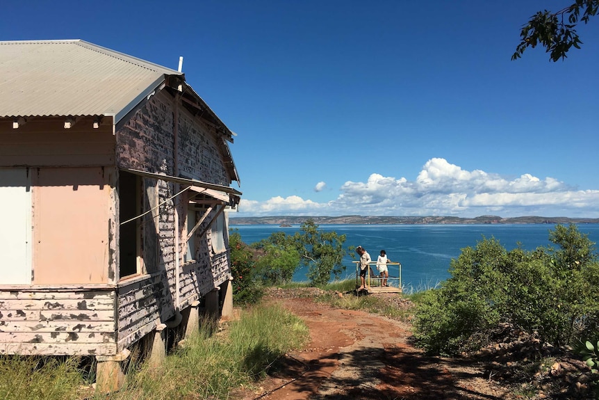 A faded pink chalet at Cockatoo Island, overlooking the ocean at Yampi Sound