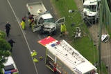 Aerial of emergency authorities responding to head-on smash 