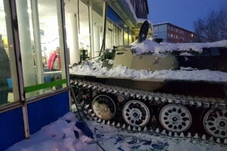 Tank rams into show window