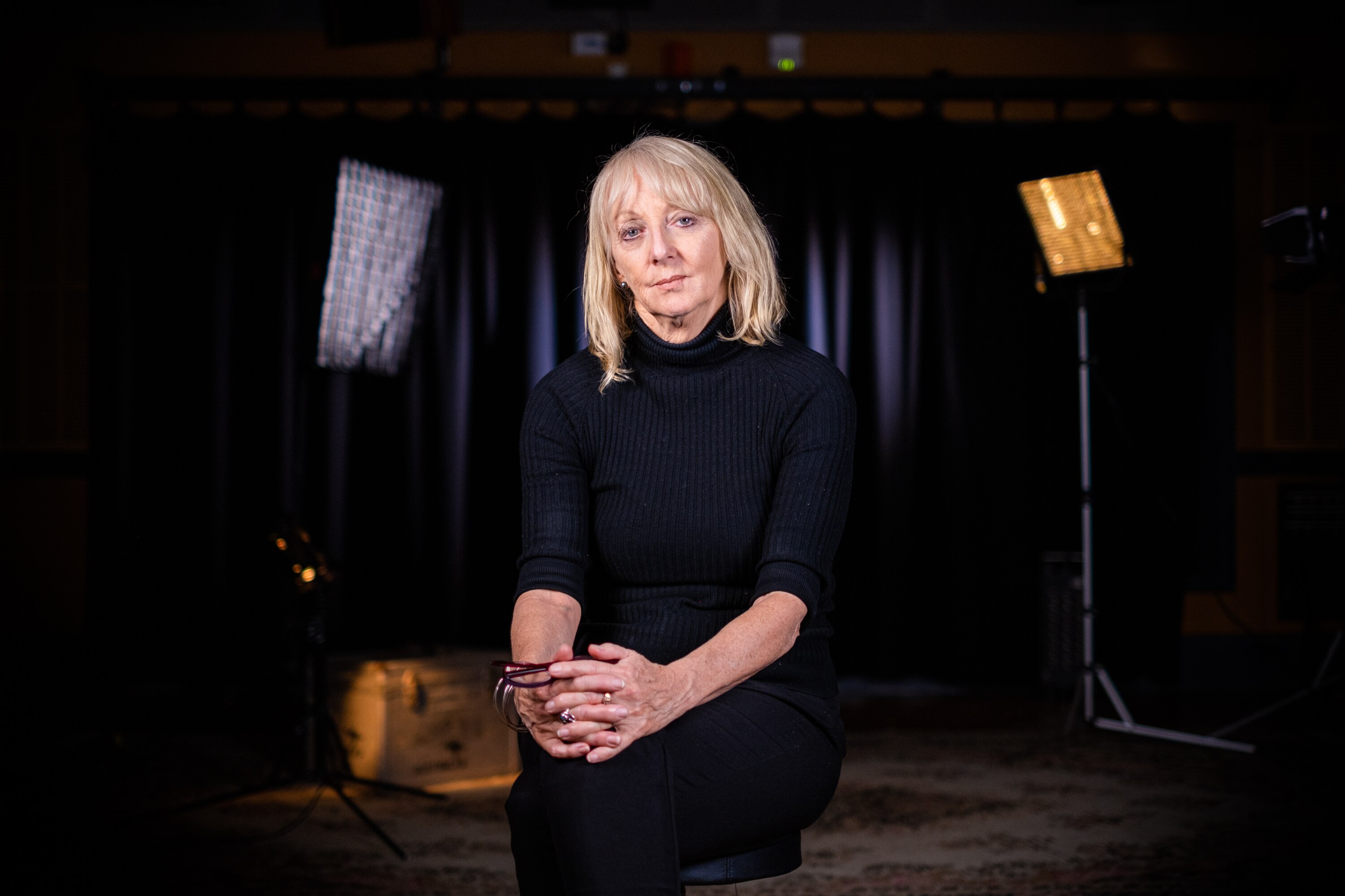 Executive Producer of Four Corners Sally Neighbour in a dark studio.