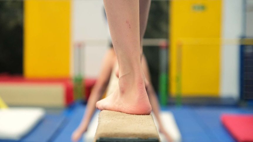 A gymnast trains