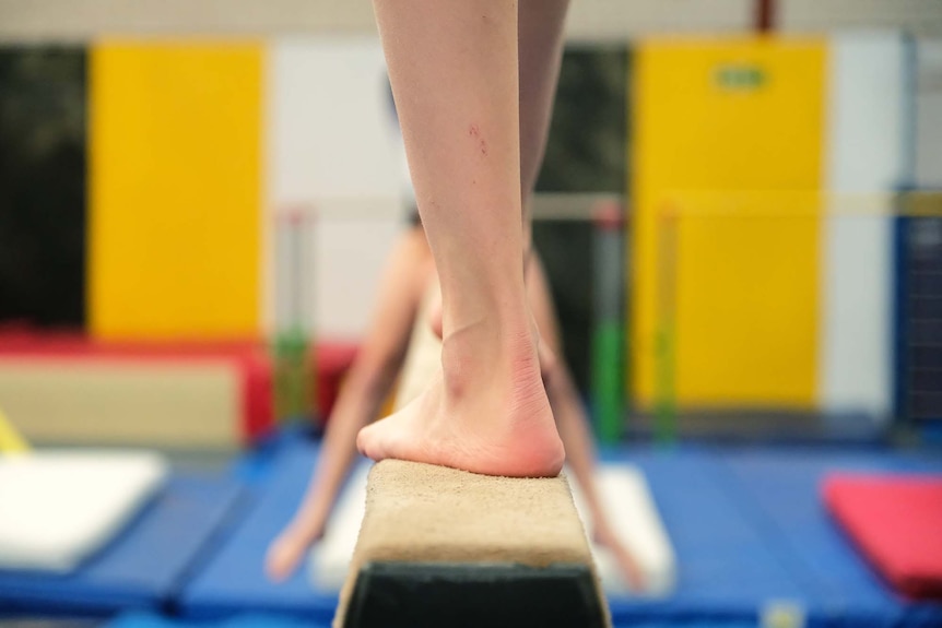 A gymnast trains