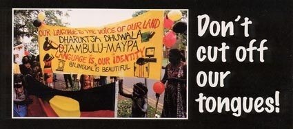 A postcard which reads 'don't cut off out tongues' and a photo of people holding a banner