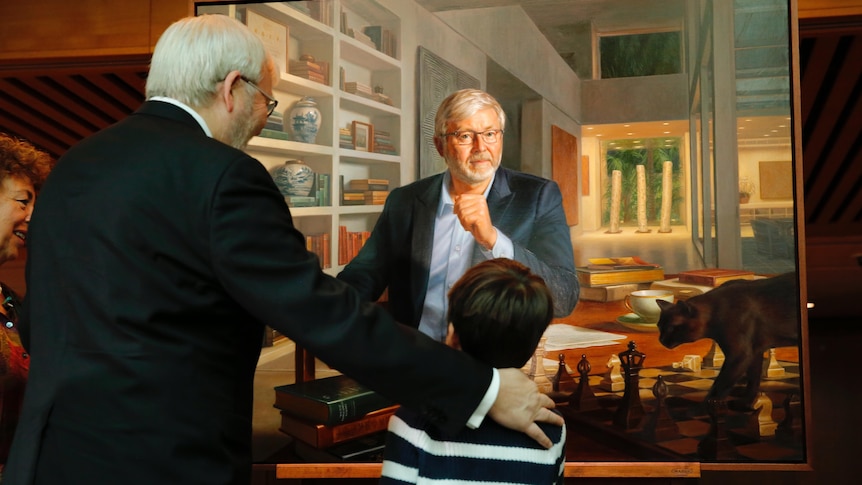 Kevin Rudd admires his prime ministerial portrait