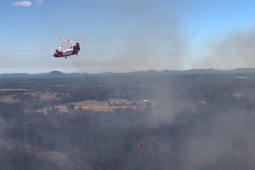 Aircraft flying over smoky landscape