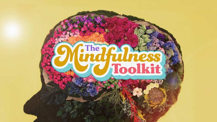 Outline of brain filled with flowers and the text 'The Mindfulness Toolkit'