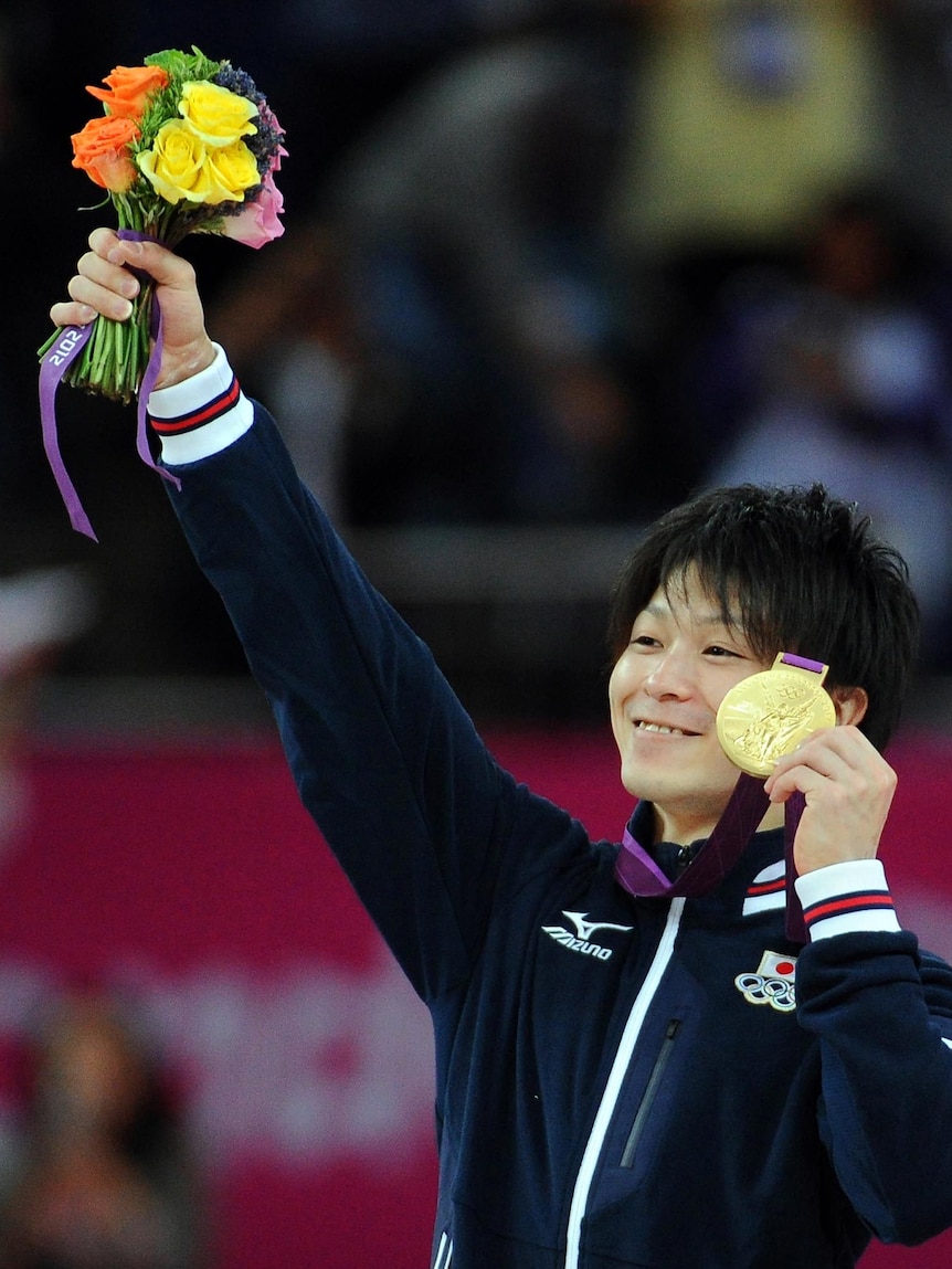 Kohei Uchimura with his gold medal after the artistic gymnastics men's individual all-around final.