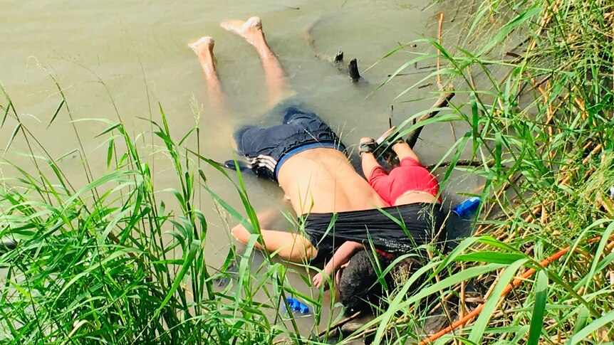 The bodies of a Salvadoran migrant father with his daughter face down on the bank of a river in Mexico.