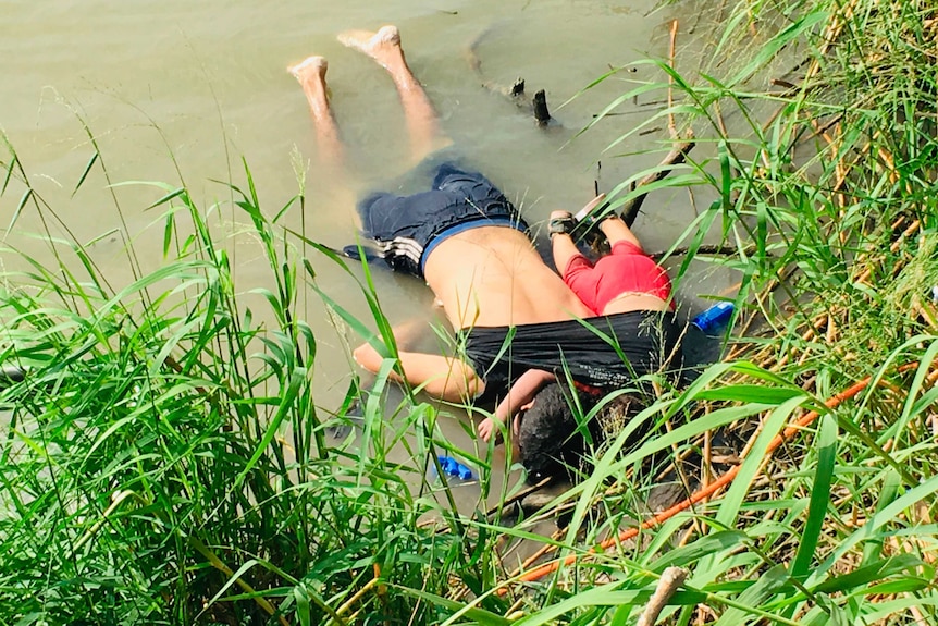 The bodies of a Salvadoran migrant father with his daughter face down on the bank of a river in Mexico.