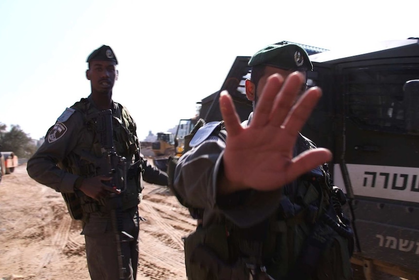 Israeli soldiers try to stop filming