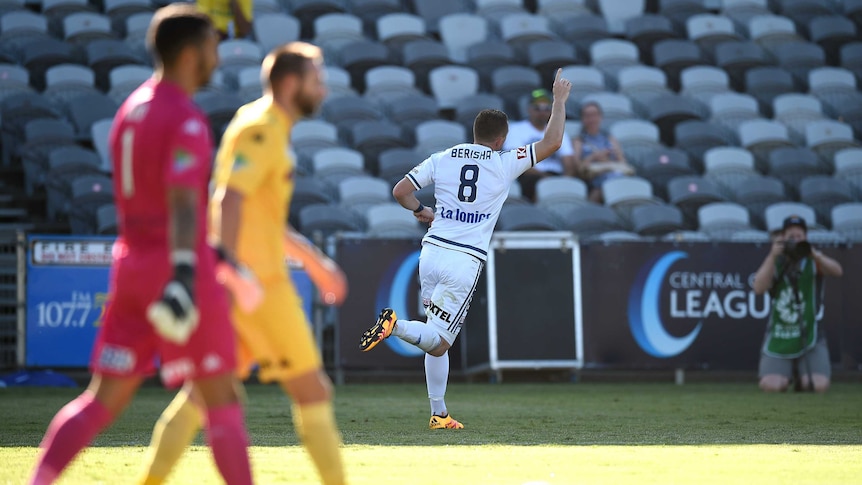 Melbourne Victory's Besart Berisha gestures to crowd after scoring against the Mariners in Gosford.