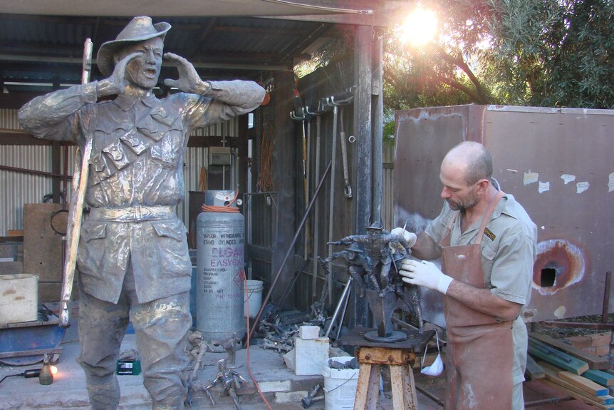 Sculptor Brett Garling works on a piece depicting the Gallipoli landing.