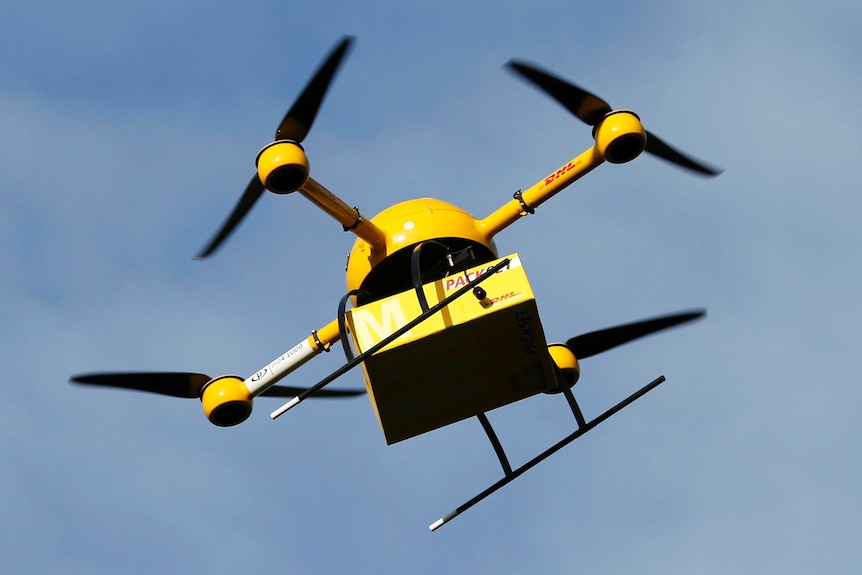A yellow delivery drone with four black rotors called a "parcelcopter"