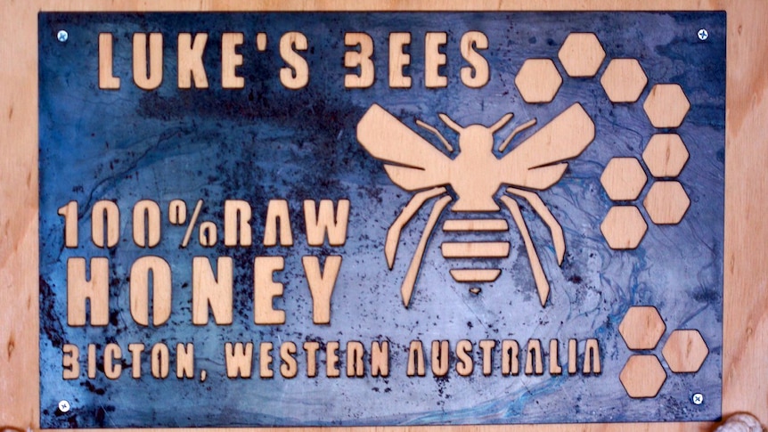 A sign advertising honey produced by Luke's Bees, a business run by beekeeper Luke de Laeter, 16.