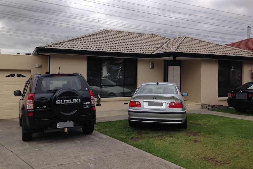 The front window of a house on George Cudleigh Drive in Hallam appeared to be broken after the raid.