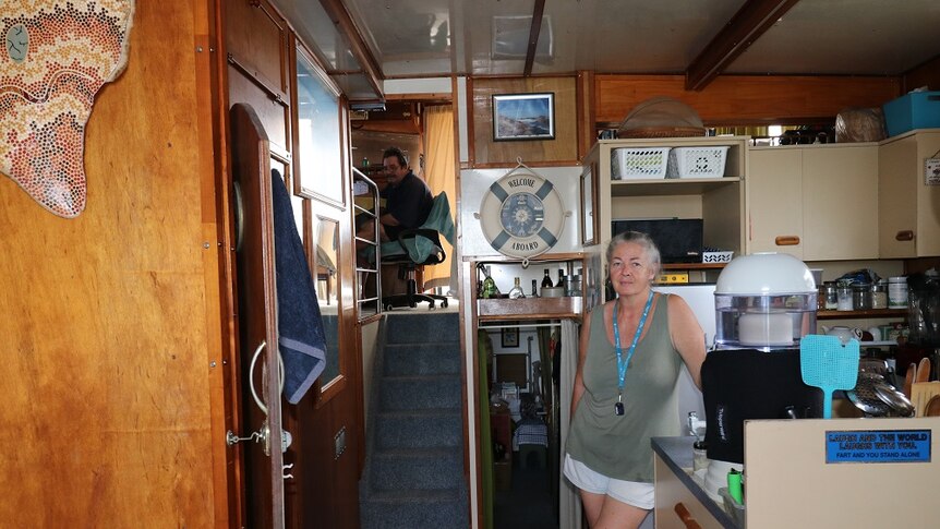 Two people in the interior of a boat