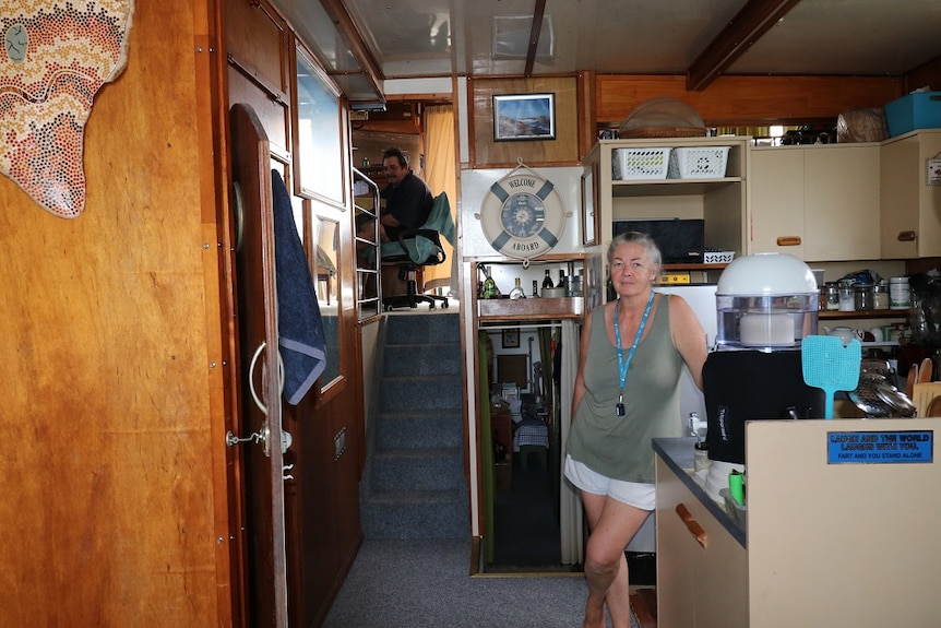 Two people in the interior of a boat