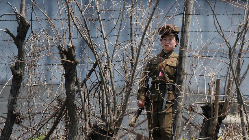 Guard stands watch outside a North Korean prison