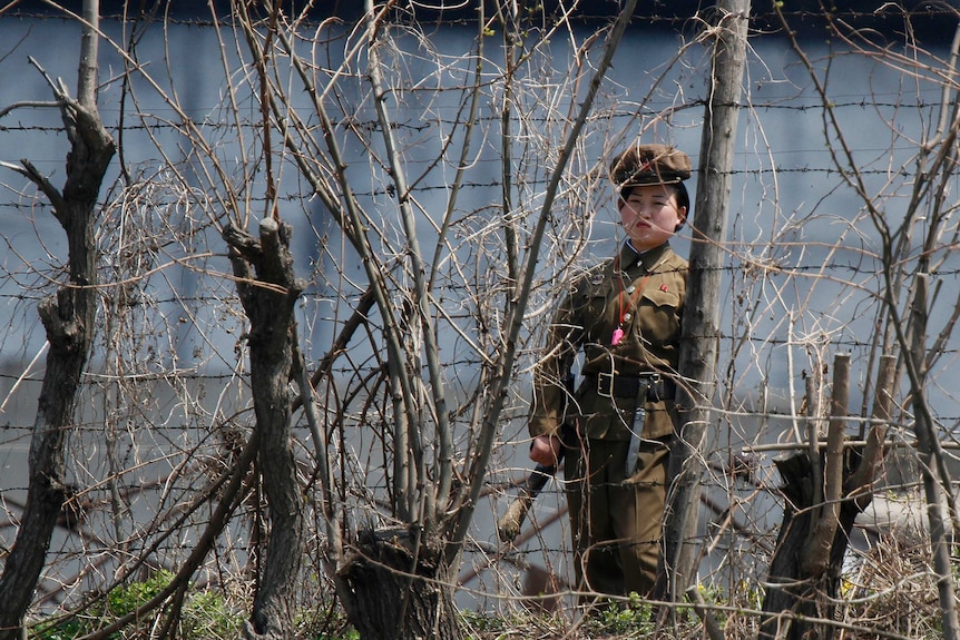 Guard stands watch outside a North Korean prison