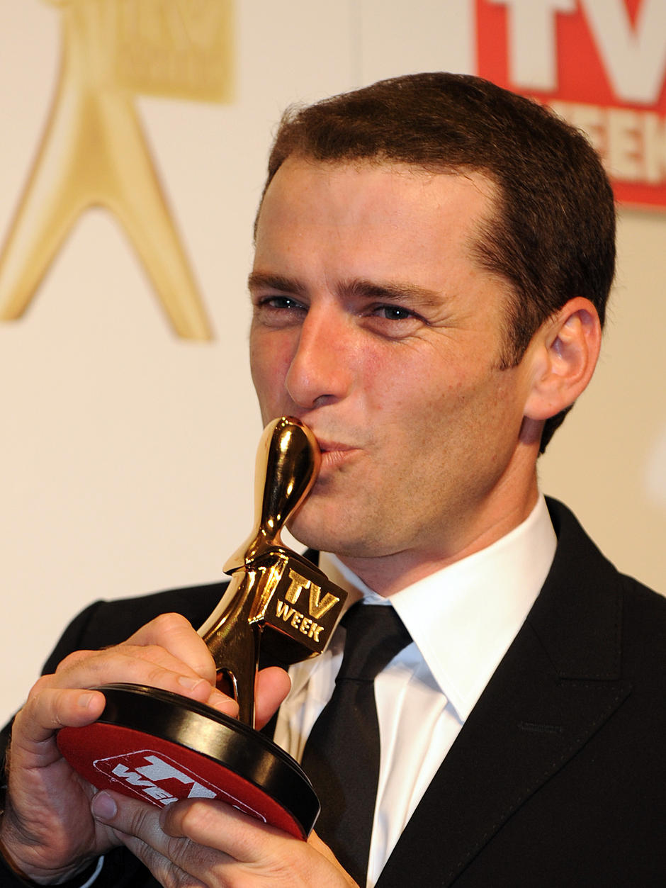 Karl Stefanovic from the Channel 9's Today Show kisses his Gold Logie