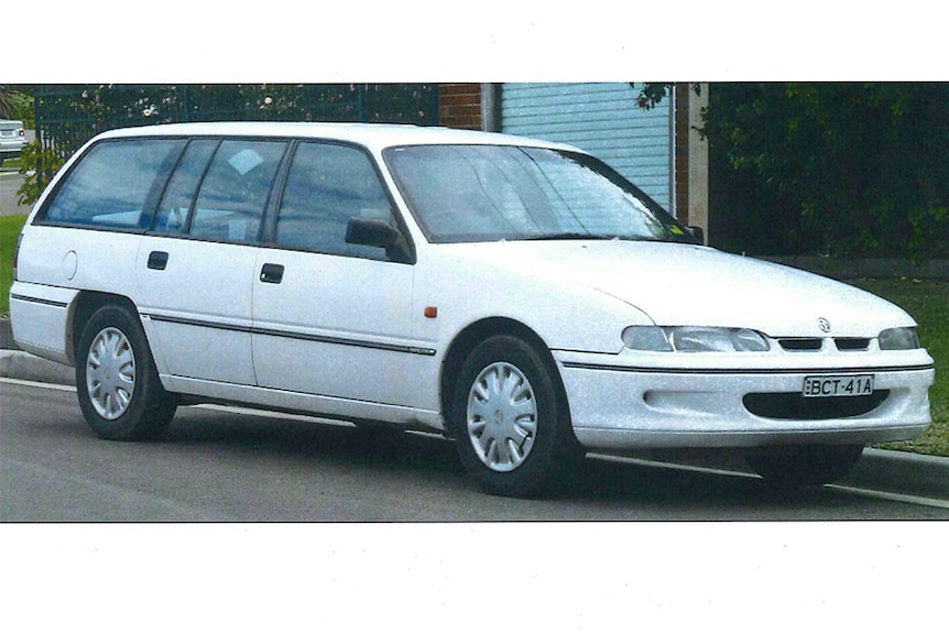 A white Holden Commodore station wagon