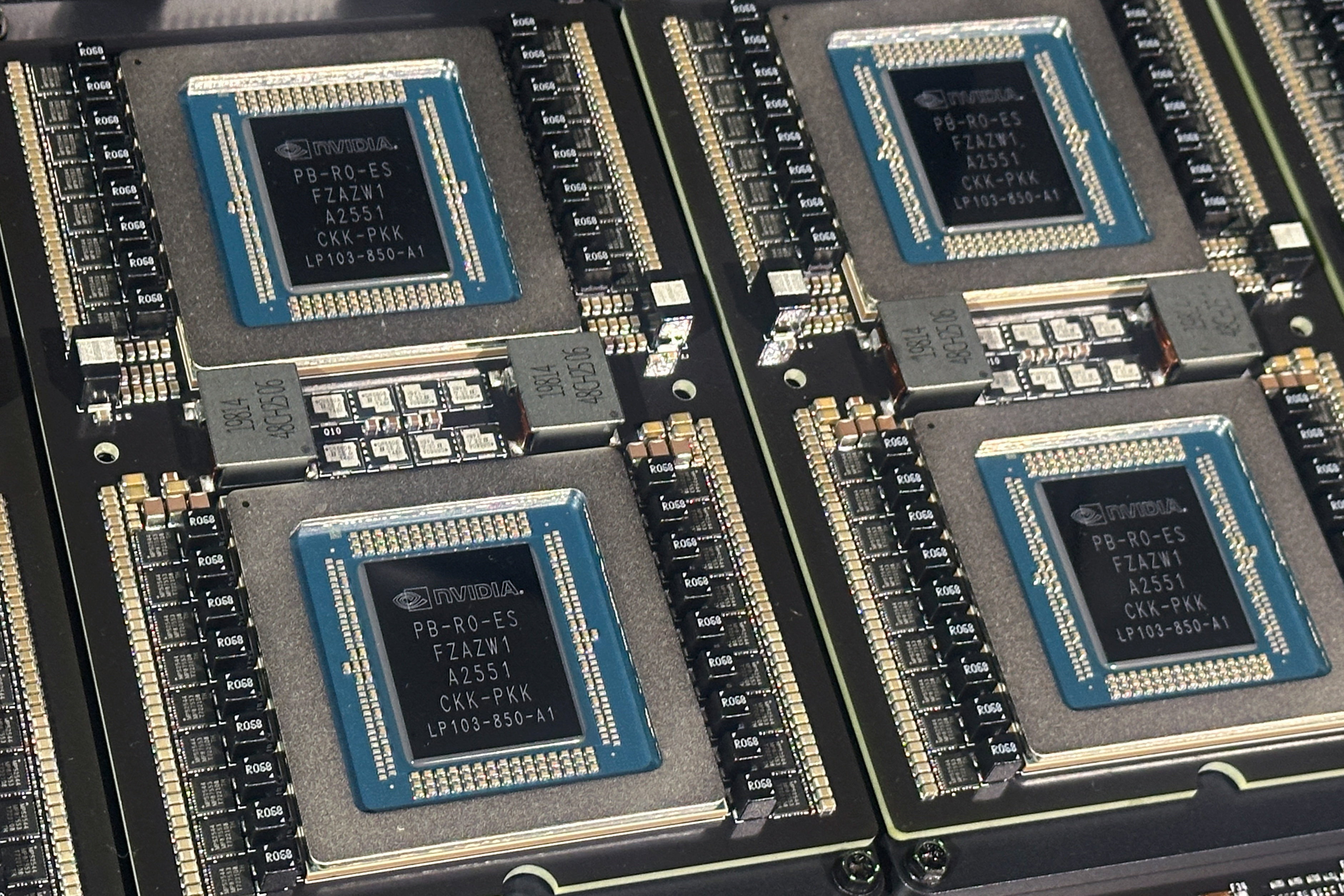 Four computer chips with the Nvidia brand logo.