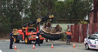 Rafts from the Thunder River Rapids ride being moved into the Dreamworld car park