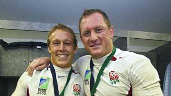Jonny Wilkinson and Richard Hill of England celebrate in the dressing rooms