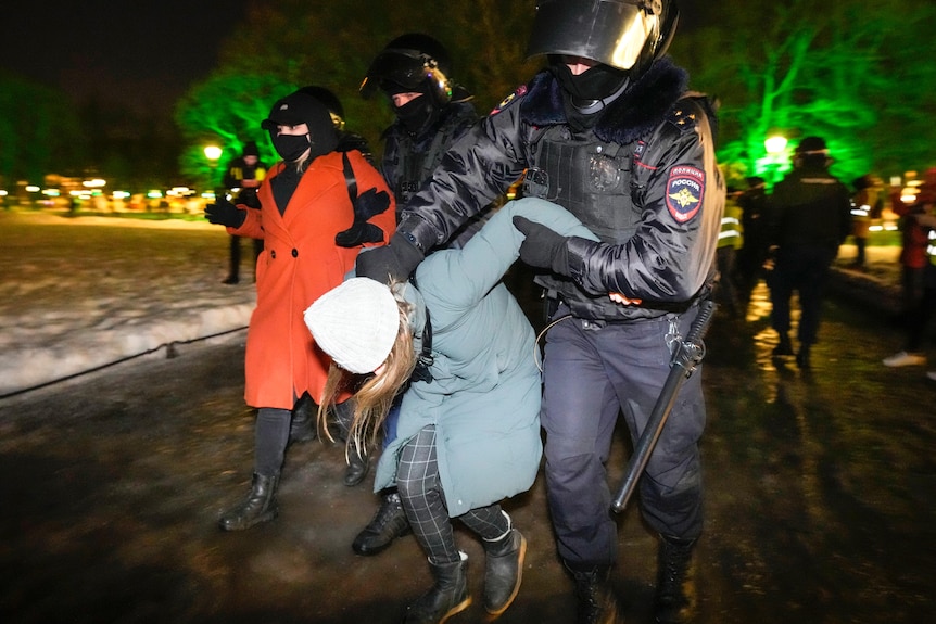 Two women are detained by Russian police in St Petersburg.