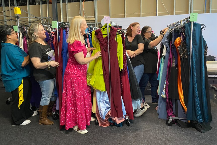 Volunteersat The Formal Project sorting dresses
