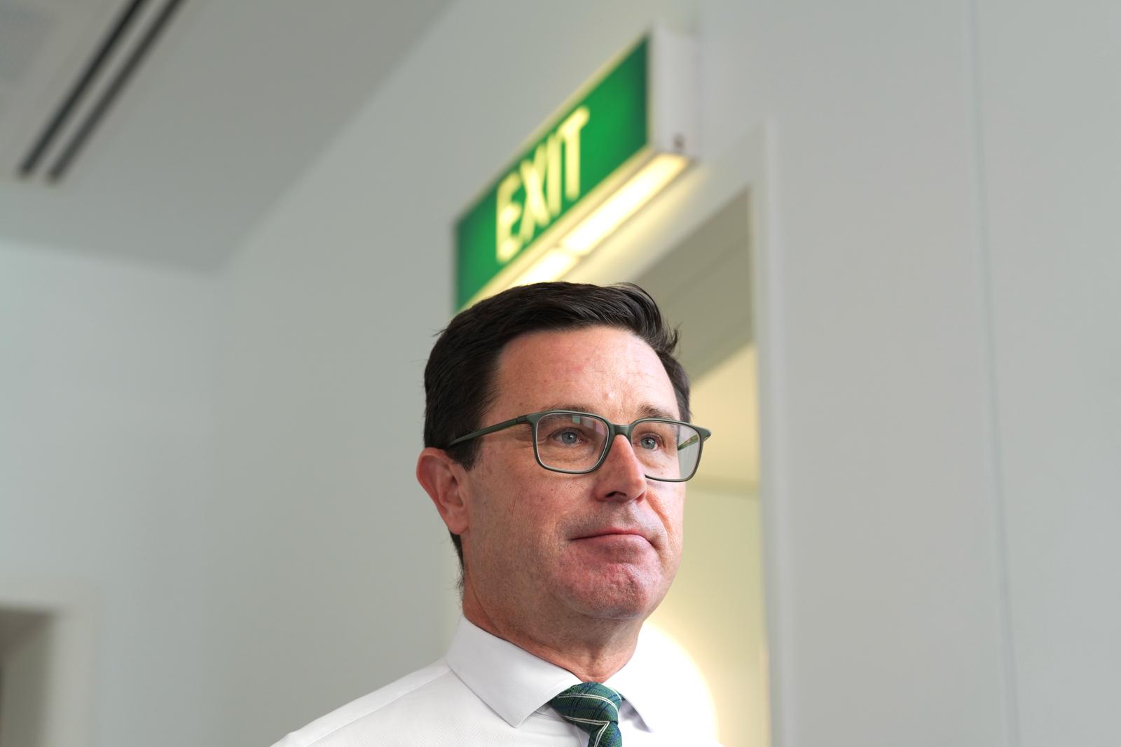 Nationals leader David Littleproud stands in front of an exit sign.
