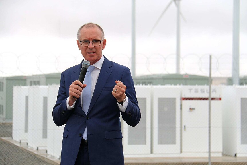 Premier Jay Weatherill standing in front of the Tesla battery in SA's Mid North