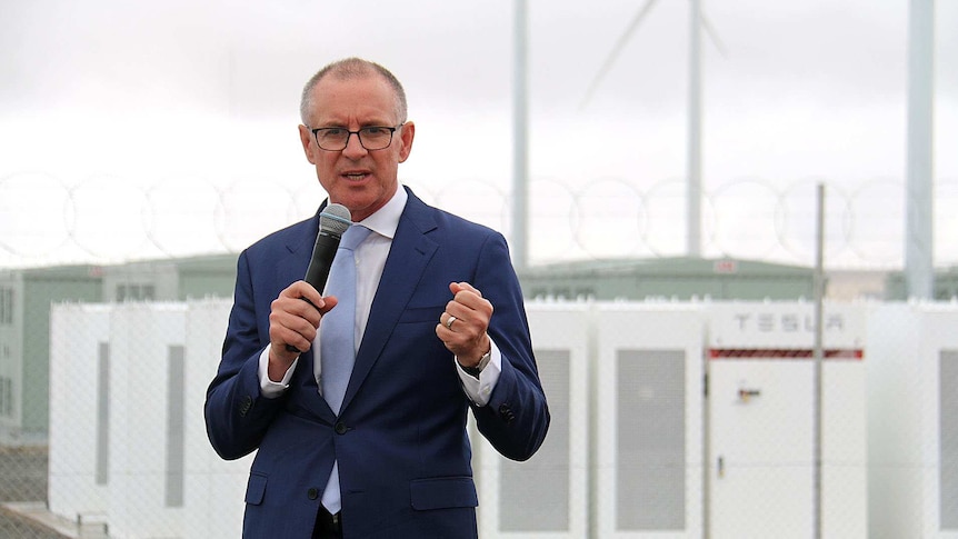 Premier Jay Weatherill standing in front of the Tesla battery in SA's Mid North
