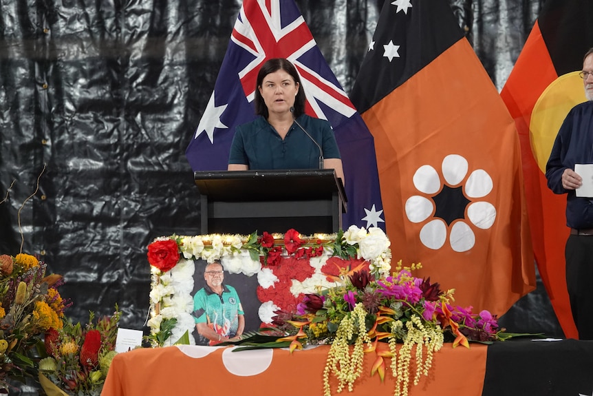 NT Chief Minister Natasha Fyles standing at a lectern onstage and speaking.