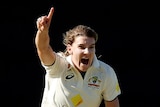 Australia bowler Annabel Sutherland celebrates a wicket in a Test against South Africa by pointing and shouting.