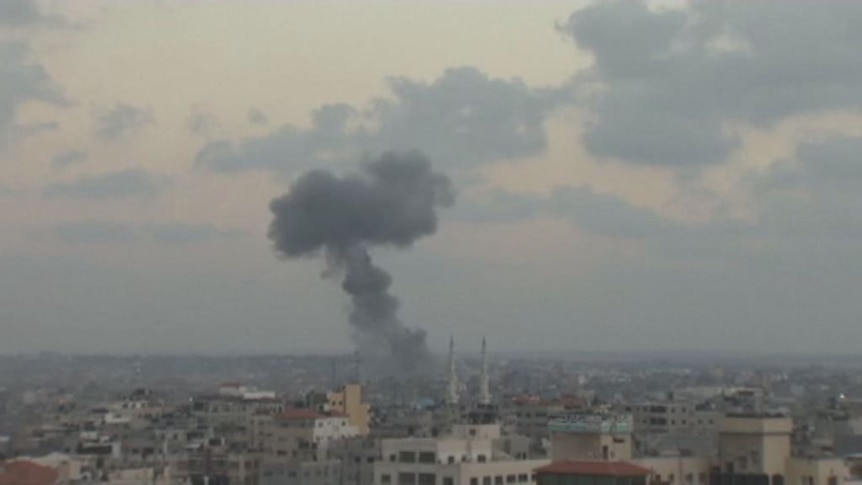 Smoke rises following an Israeli air strike in Gaza City.