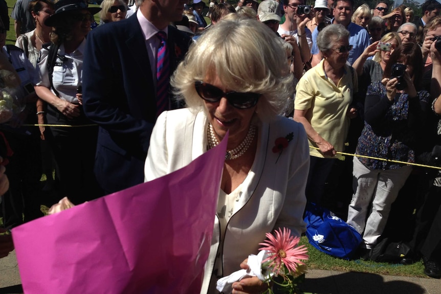 The Duchess of Cornwall receives a bouquet of flowers