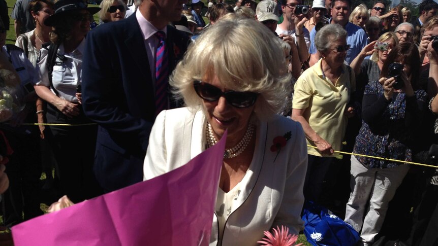 The Duchess of Cornwall receives a bouquet of flowers