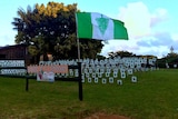 Norfolk Island flag and protest signs
