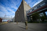 Russian servicemen guard an area of the Zaporizhzhia Nuclear Power Station.